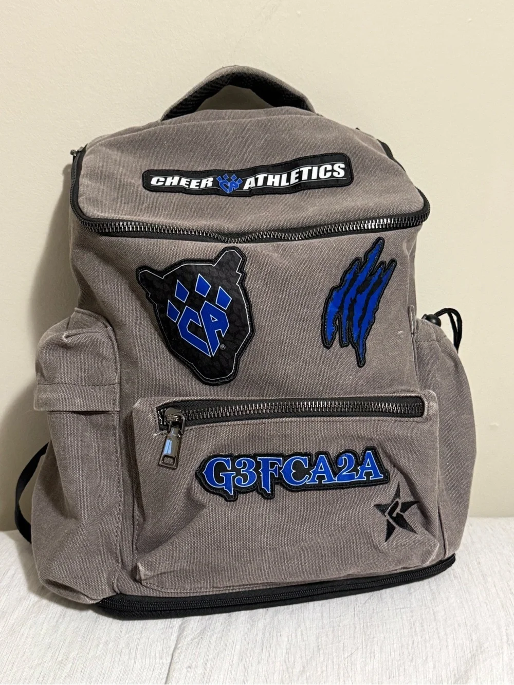 Gray Canvas Backpack with Blue Patches